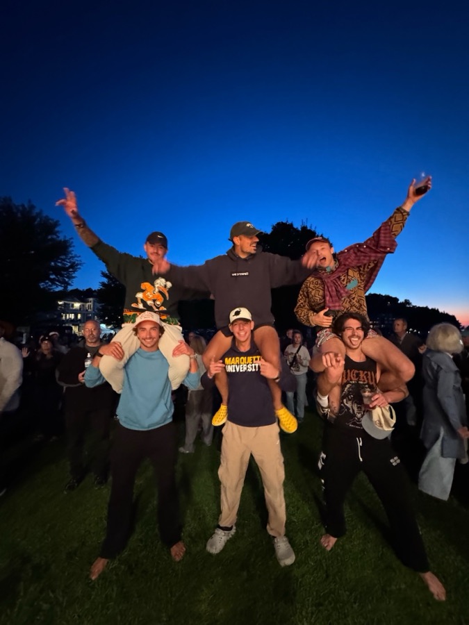 On shoulders at a summer concert
