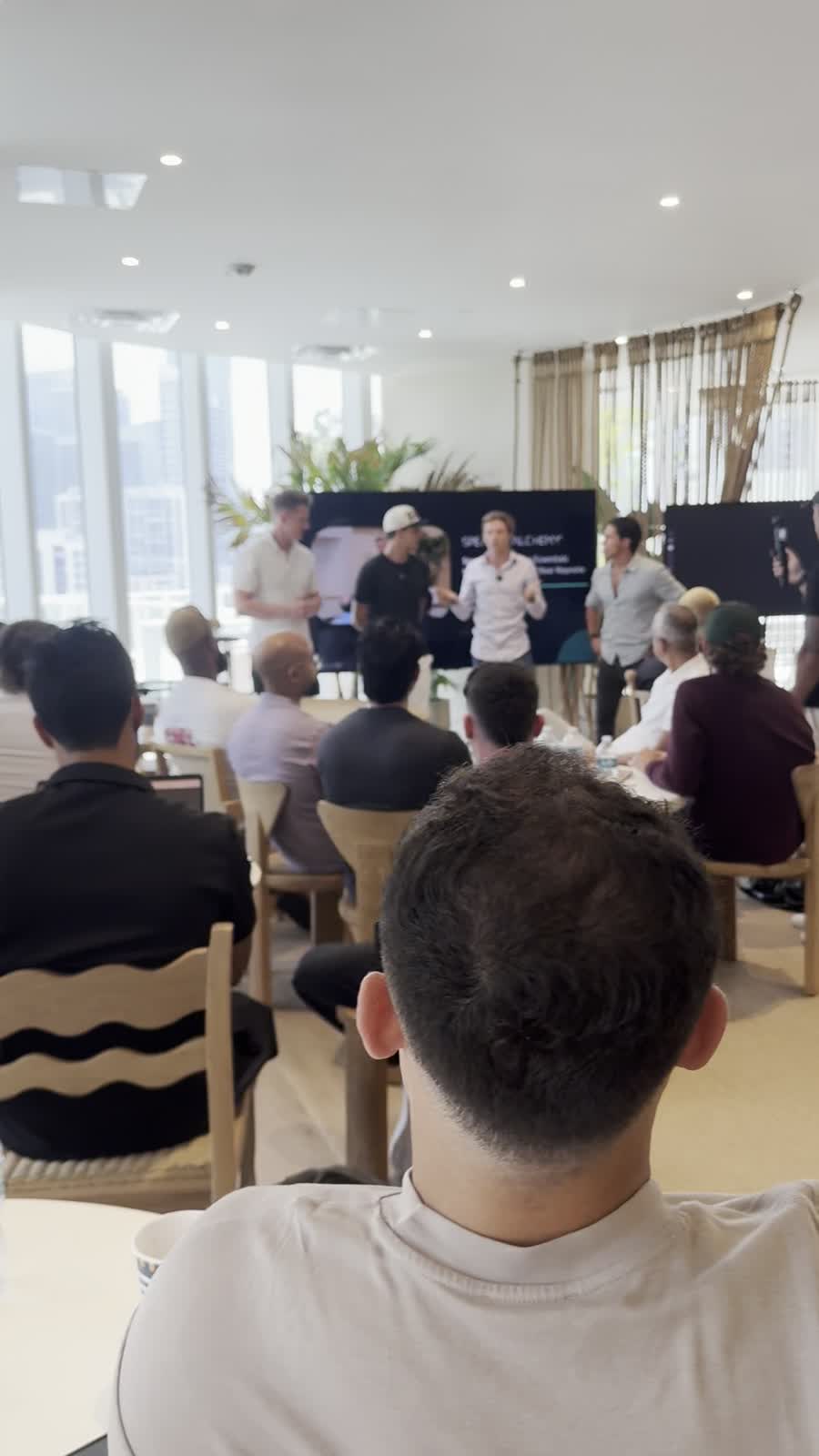 Members watching a talk at a Miami Founders event