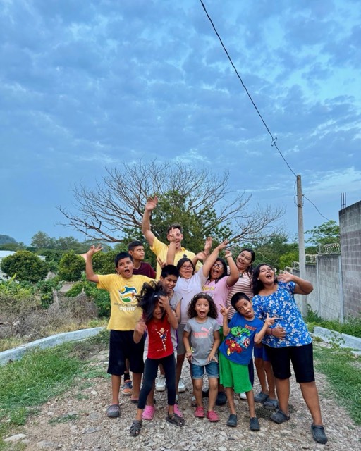 Casa De Amor children receiving supplies